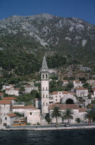 Church belltower viewed across water