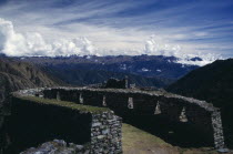 Inca ruins on the Inca trail to Machu Picchu with views of the surrounding landscape Cuzco