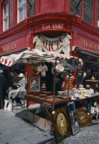 Portobello Road antique shop in the market with a stall outside on the pavement