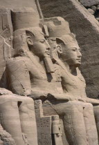 Two of the giant statues of Ramesses II at the entrance to the Great Temple