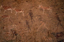 Bushman rock painting depicting men with spears and cattle