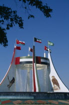 Falcon Fountain with flags flying on top. Part of the Hotel Intercontinental United Arab Emirates