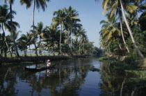 Near Kumarakom. A single person paddling in a local boat on the backwaters. Kerela