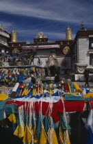 Prayer wheels and other religious paraphernalia for sale in front of the Jokhang Temple