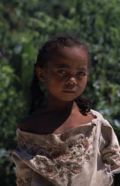 Road to Ambalavao. Portrait of a young girl wearing pig tails in her hair