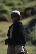 Portrait of a girl smiling wearing a white hat and black jacket