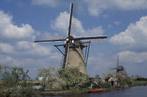 Windmill seen from across water Netherlands