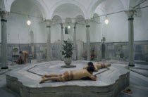 Seraglio Point.  Gagaloew Baths Turkish hamam interior with male bathers.