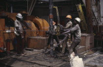 Workers on oil rig.