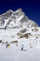 Skiers on the slopes of the Matterhorn ski range.