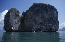 Fishermen in boats beside one of the many small islands off the south coast of the main island