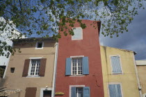 Colourful building with shutters Colorful