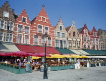 The west side of the Main Square  Grote Markt  with outdoor restaurants and umbrellas