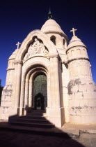 Supetar Petrinovic mausoleum. The Petrinovic mausoleum by Toma Rosandic lies at the western edge of the town cemetary. with its neo Byzantine dome and sculpted pillarssouthern Croatia