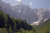 The North Face of Mount Triglav at the end of Vrata Valley the longest valley in Slovenia and the source of the Bristica Rivericonic mountainsnow patchesconifersnumerous climbing routesonly Natio...