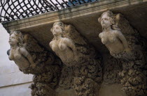 Via Nicolaci. Detail of sculpted female figures on ornate balconies