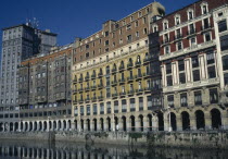 Riverside arcade with flats and offices.