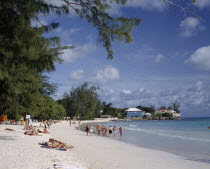 Rockley Beach  white sand  sunbathers  houses on headland  trees