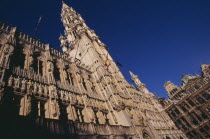 The Grand Place.  Hotel de Ville.  Angled view of exterior facade decorated with statues representing the Dukes and Duchessess of Brabant.