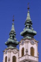 Church of St Anne in Batthyany Square.  Detail of twin clock towers with copper spires.Eastern Europe  Eastern Europe