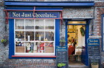 Not Just Chocolate confectionary shop opposite the market cross.Great Britain UK United Kingdom British Isles Store