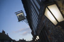 Lantern and sign outside the George Inn pub in the high street.Great Britain UK United Kingdom British Isles Public House