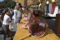 French Market. Selection of sausages and cured meat on display in baskets on stallGreat Britain United Kingdom UK