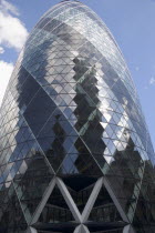 The Swiss Re building 30 St Mary Axe alternatively known as the Gherkin seen from street level. Designed by Architect Sir Norman Foster.United Kingdom  City Great Britain UK