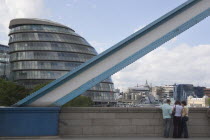 Detail of Tower bridge with the GLA City Hall glass offices behind. Designed by Sir Norman FosterUnited Kingdom  Greater London Authority Glass Testicle Southbank Great Britain UK