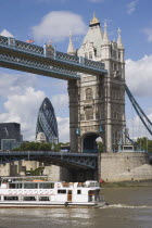 Detail of  Tower Bridge on the River Thames with the Gherkin tower seen through the bridge.United Kingdom  30 St Mary Axe Great Britain UK