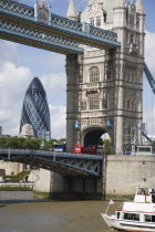 Detail of  Tower Bridge on the River Thames with the Gherkin tower seen through the bridge.United Kingdom  30 St Mary Axe Great Britain UK