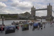 The Queens walk open air exhibition outside the GLA city hall with Tower Bridge behind.United Kingdom  Greater London Authority Thames Southbank Great Britain UK