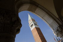 The Campanile in Piazza San Marco seen through an arch below the Doges Palace