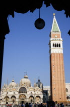 The Campanile and Basilica of St Mark in Piazza San Marco filled with tourists