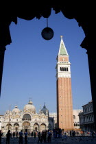 The Campanile and Basilica of St Mark in Piazza San Marco filled with tourists