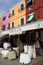 Brightly coloured houses above lace shops on the lagoon island of Burano the historic home of the lace making industry in the region. Colored