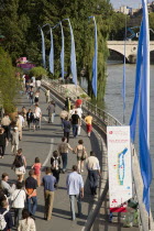 The Paris Plage urban beach. People strolling beside the River Seine along the Voie Georges Pompidou usually a busy road now closed to traffic