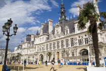 The Paris Plage urban beach. Young people playing beach rugby football in front of the Hotel de Ville Town Hall