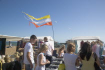 MArket stall on the seafront beside the ruins of the West Pier.Great Britain United Kingdom