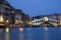 The Rialto Bridge on the Grand Canal illuminated at night