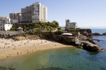 The Basque seaside resort on the Atlantic coast. The Plage de Port-Vieux with a seafood restaurant on a promontory at the end of the beach.