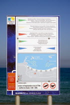 The Basque seaside resort on the Atlantic coast. Seaside safety sign on the Grande Plage beach.