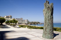 The Basque seaside resort on the Atlantic coast. The Grande Plage beach with a sculpture of a raised hand on the seafront.