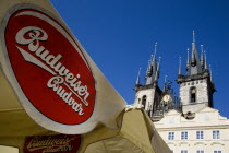 Restaurant umbrellas advertising the original Czech Budweiser Budvar in the Old Square in front of the Church of Our Lady before Tyn