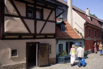 Golden Lane within Prague Castle. Originally built for castle guards  then Goldsmiths moved in giving it the name. Now tourist shops.