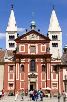 The facade and towers of St George Basilica within Prague Castle