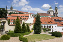 The 18th Century Vrtba Gardens with St Vitus Cathedral in Prague castle to the left and the Church of St Nicholas on the right