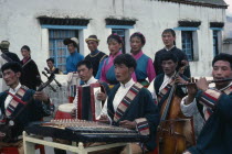 Village orchestra and dancers in traditional dress.