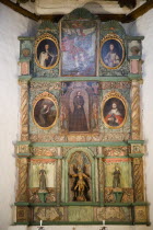 The altar panel of the San Miguel Mission church with Spanish an Native American inspired artwork