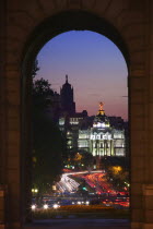 Night time view along Calle de Alcala towards the Gran Via from the Puerta de Alcala  seen through an arch.TravelHolidaysTourismRoadBridge